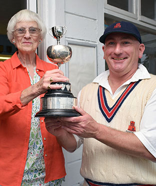 Angela Glendenning presents the Brockman Cup to Paignton captain Matt Williams after the 2019 final at Torquay