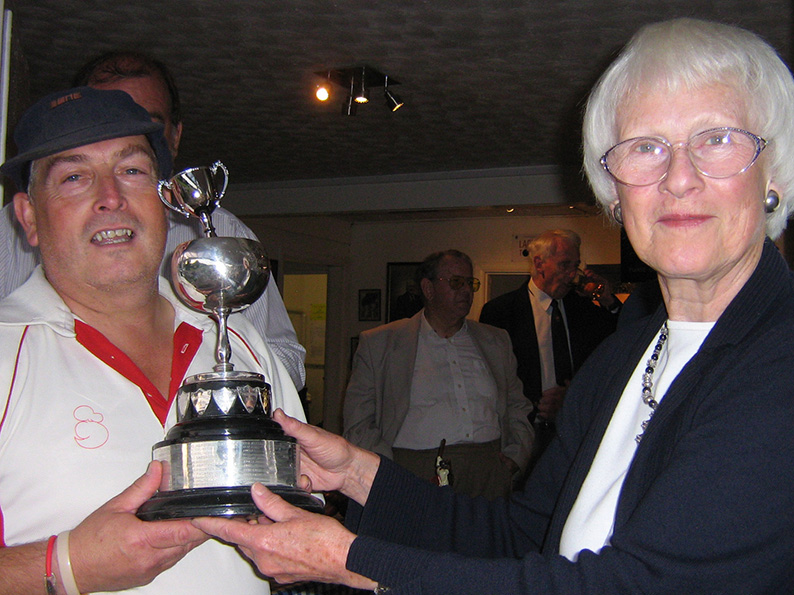 Paignton's winning captain Richard Lloyd collecting the Brockman Cup