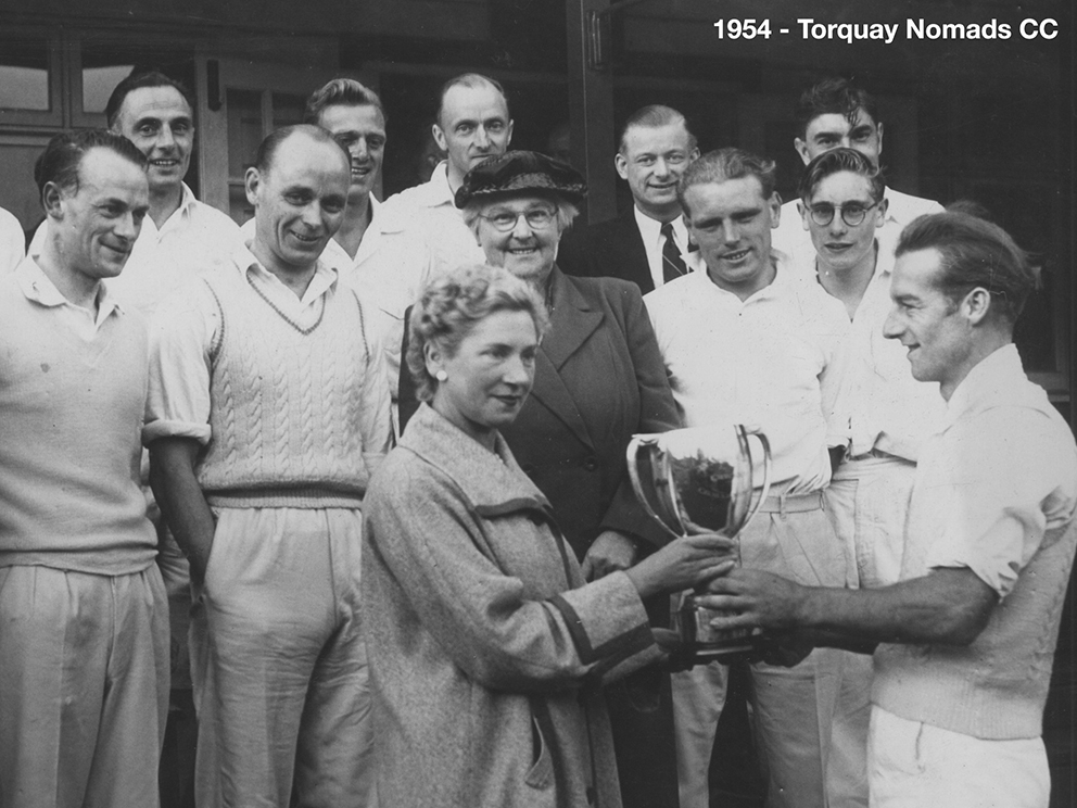 R Oarsman, captain of the victorious Nomads team, collecting the cup from Mrs Bettina Narracott on the steps of the Torquay pavilion