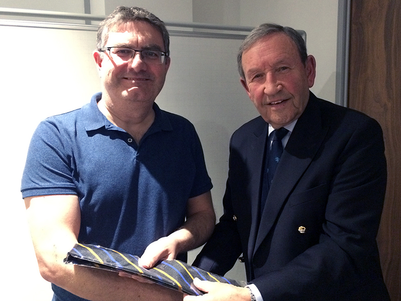 Terry Mohan (left) is pictured being presented with a Devon tie by the club president Roger Moylan-Jones 