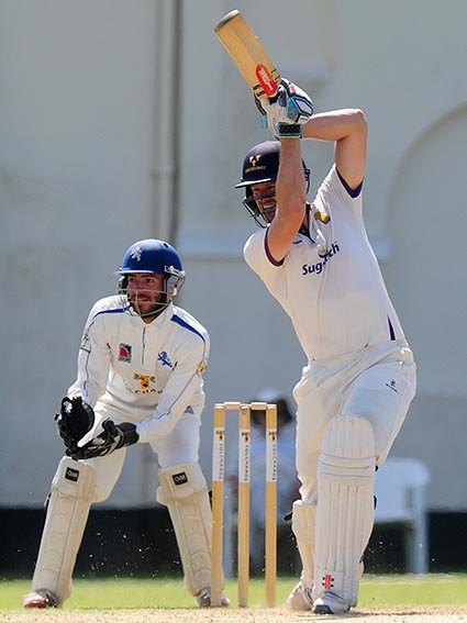 Wayne White batting for Cheshire against Devon. The wicketkeeper is Devon skipper Matt Thompson