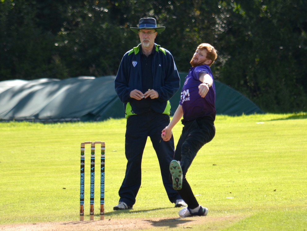 Cullompton's Dave Hooper stretches into his delivery stride in the win over Stoke Gabriel