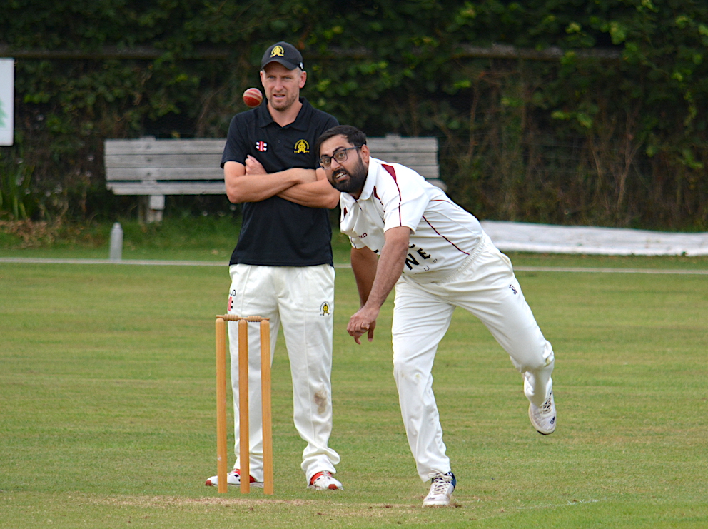 Malik Wasim coming around the wicket for Plymouth CS&R in their win at Abbotskerswell