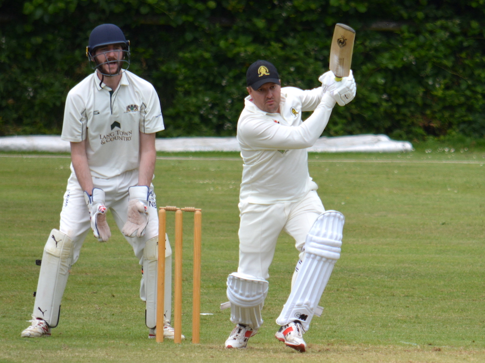 Abbotskerswell's Nick Guest gets on top of the Plymouth bowling