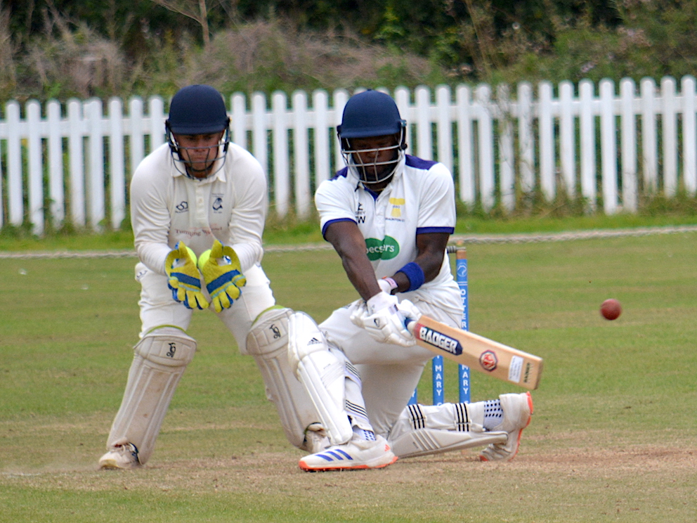 Braunton's Teriq Worrell makes room to sweep Ottery's Sam O'Nyons