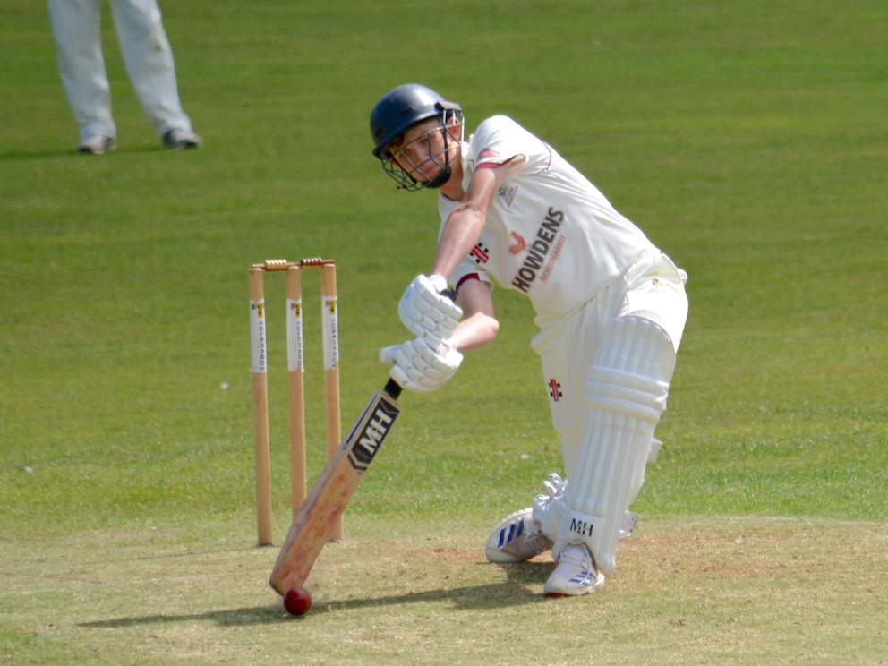 Ipplepen's Toby Alsop puts bat to ball against Dartington & Totnes