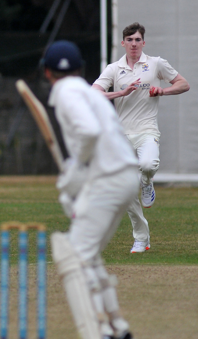 Bovey Tracey's Ben Kay bowling to Paignton's Brenton Pedley