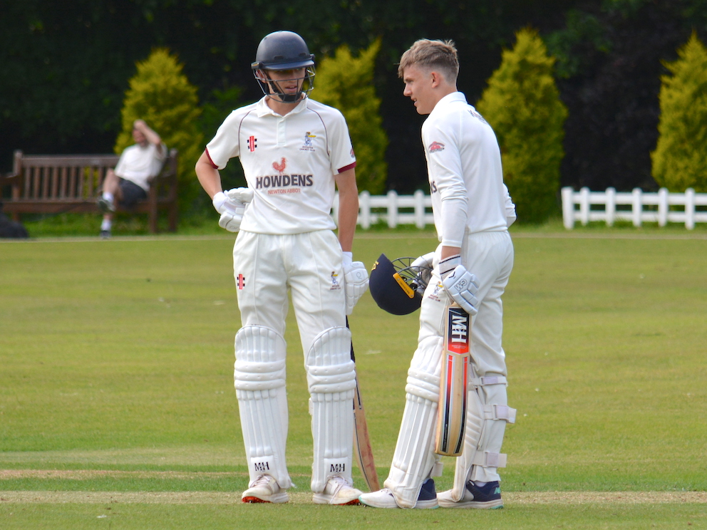 Noah Sutton (right), standing next to Toby Alsop, takes a breather after reaching his century in the game against Dartington & Totnes Noah Sutton (right), standing next to Toby Alsop, takes a breather after reaching his century in the game against Dartington & Totnes