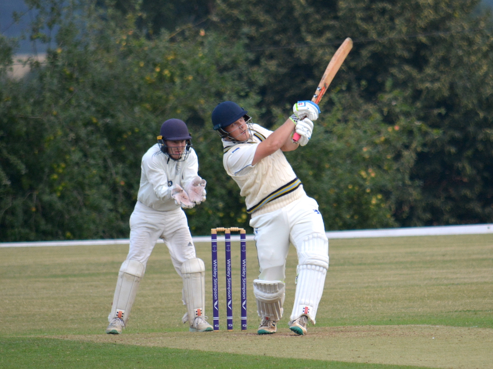 Devon's Lawrence Walker launching Oxfordshire's Luke Hayes for a six over deep mid-wicket