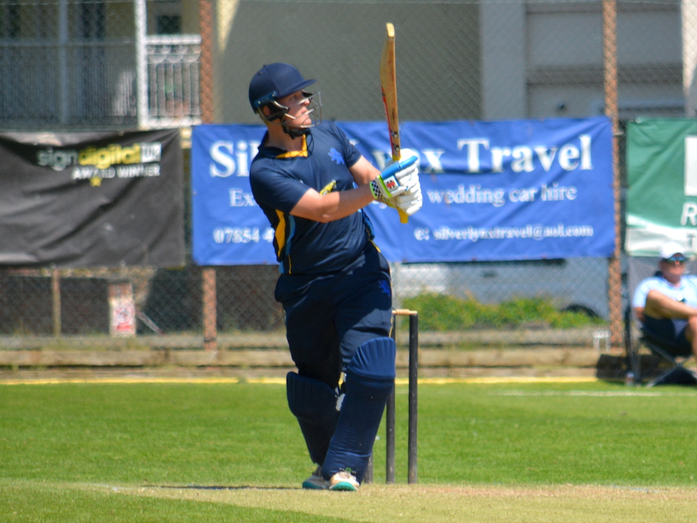 Lawrence Walker admires his handiwork after stepping outside the line of a ball from Tom Davis the smashing it over mid-wicket