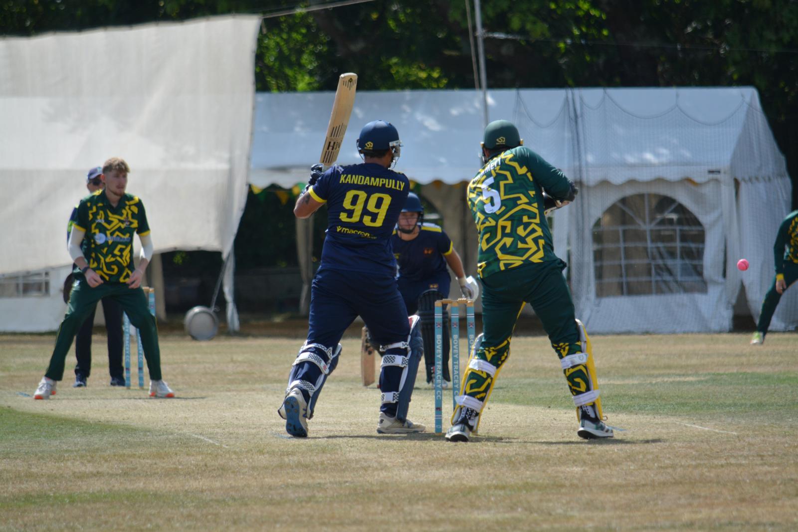 Plympton captain Harry Kandampully dispatches the Bovey Tracey bowling. He made 64 for his side in a 31-run win
