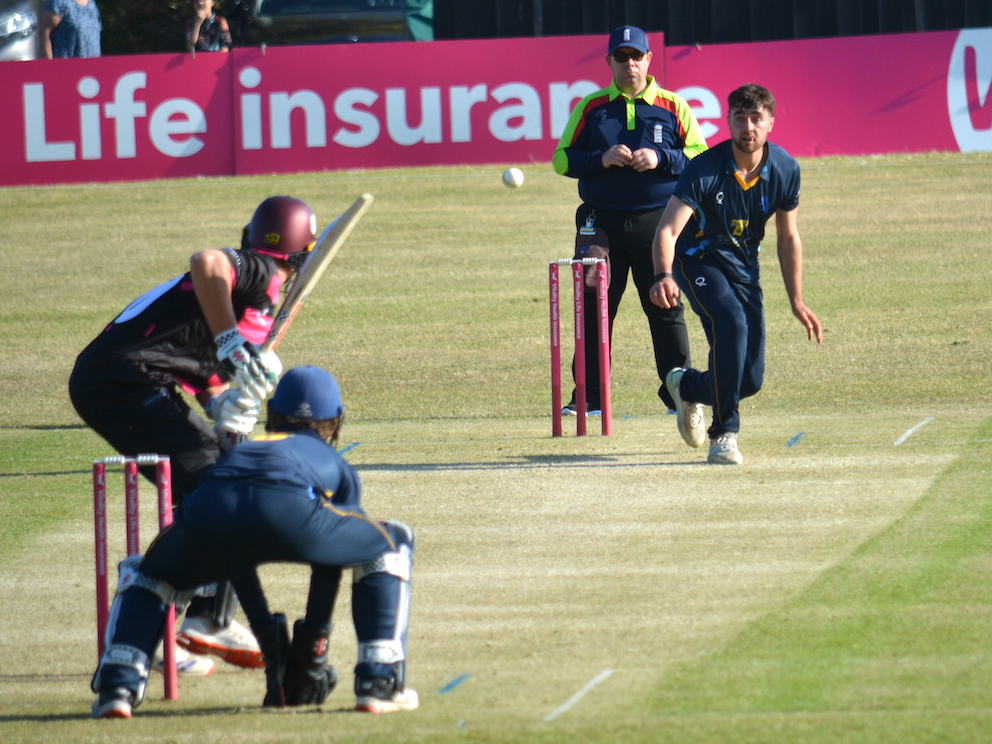 Devon's Harry Passenger bowling to his old school pal Fin Hill