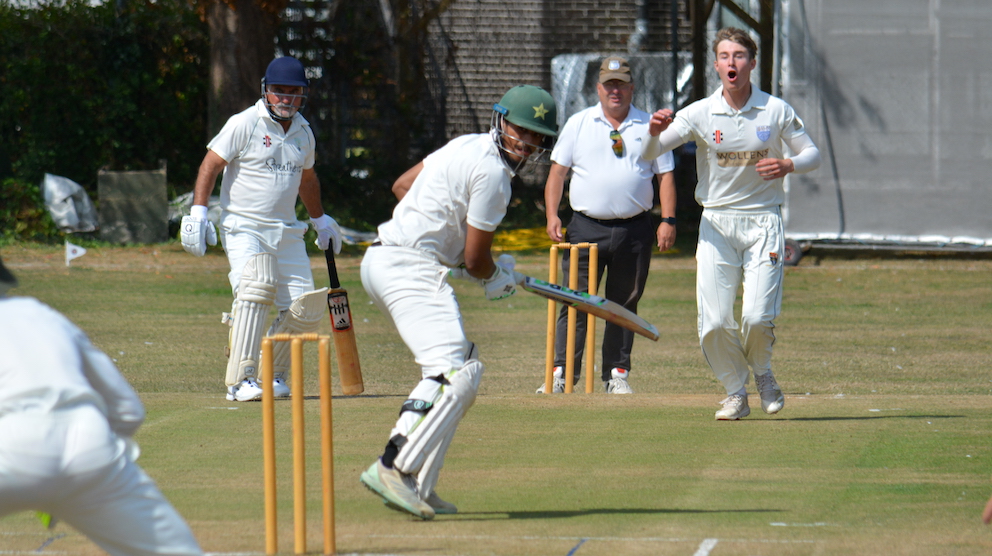 Brixham's Mo Sheikh gets away with playing and missing against South Devon's Jack Allen, whose expression tells its own story. Allen finished with four wickets