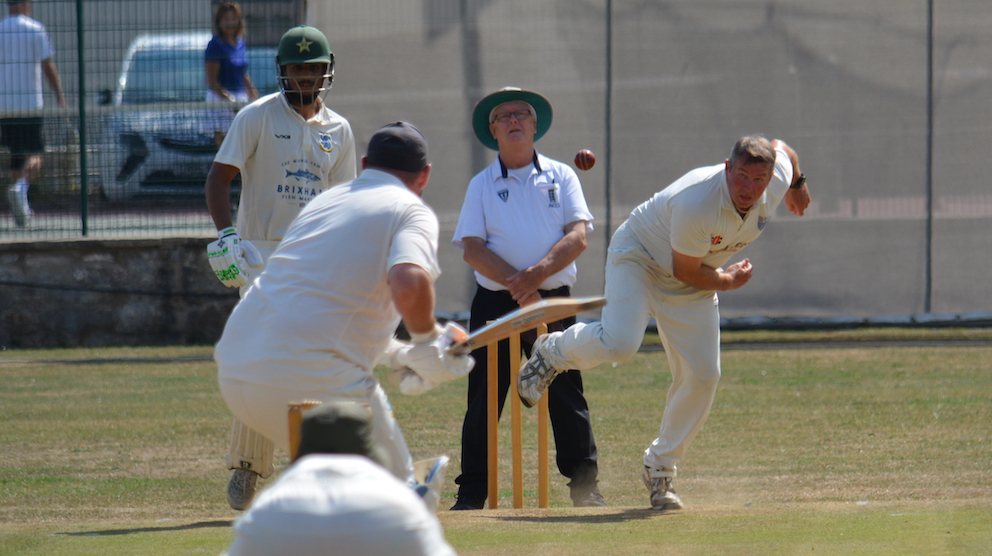 South Devon's birthday boy Jonny Martin bowling against Brixham