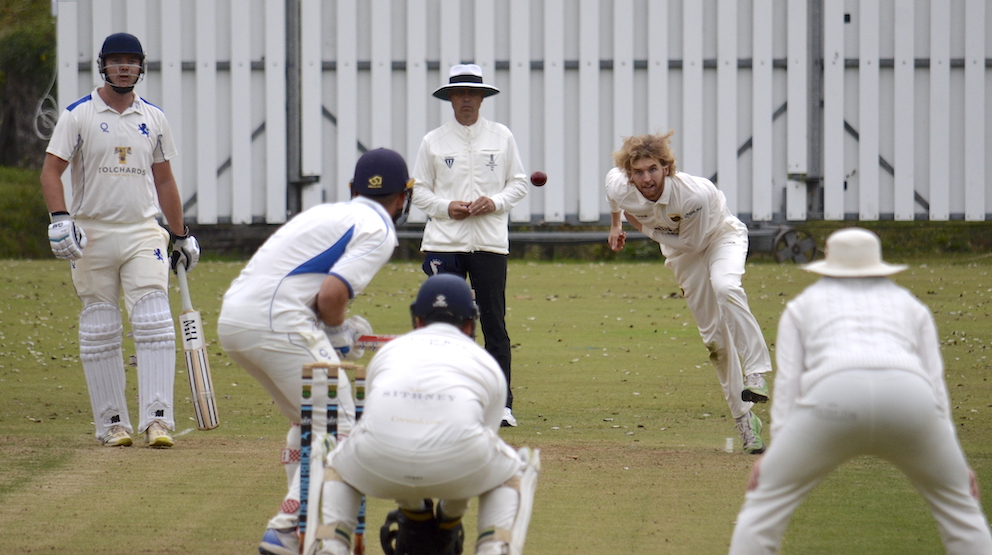 Cornwall's Max Tryfonos bowling to Devon's ton-up batter Sam Read