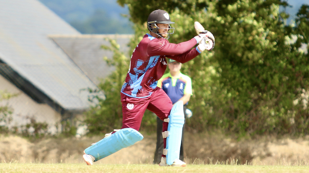 Torquay & Kingskerswell's ton-up batter Nathan Roux goes after the bowling