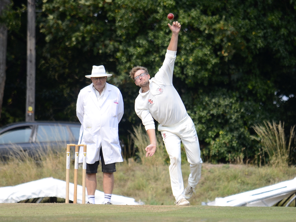 Hatherleigh's Cameron Rowlands bowling from the Pavilion End at Babbacombe 