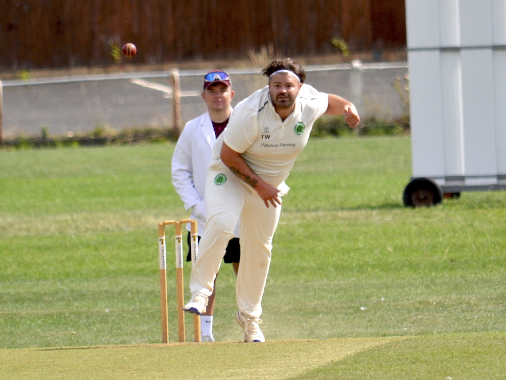 Ivybridge seamer Tom Worth plugging away against Torquay & Kingskerswell under the keen eye of umpire and DCL website correspondent Ollie Smith