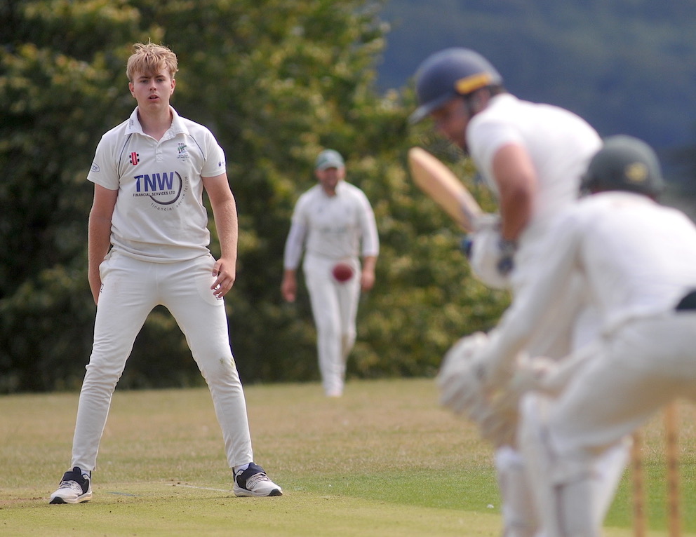 Teignmouth & Shaldon's Ross Jameson bowling against South Devon