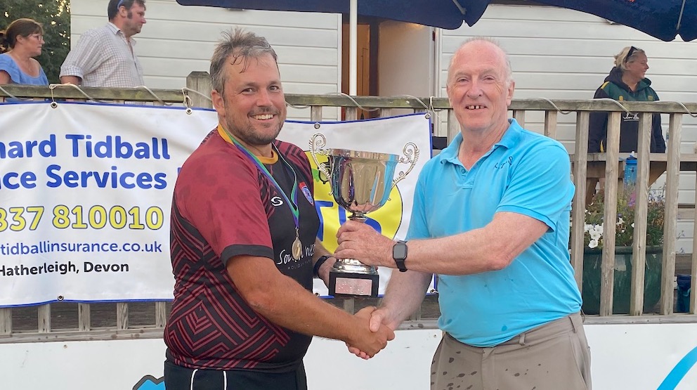 Clyst captain Stephen Bourke collects the cup from sponsor Richard Tidball