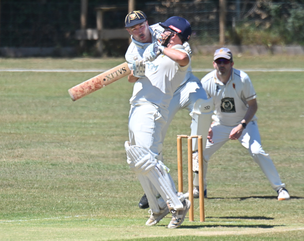 Abbotskerswell batter Simon Harrison takes evasive action against a lifting ball