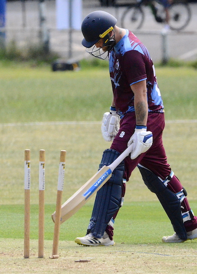 T&K's Jimmy Clifford, who has just been run-out by an Alex Jopling defection on to the stumps