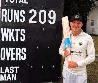 Sam Franks in front of the Kensham Park scoreboard after his breathtaking double ton
