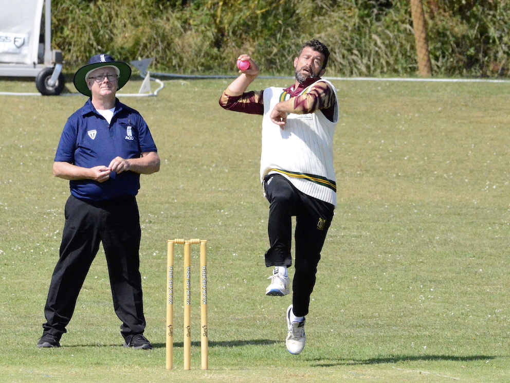 Stoke Gabriel's Mike Smith coming down the hill to bowl