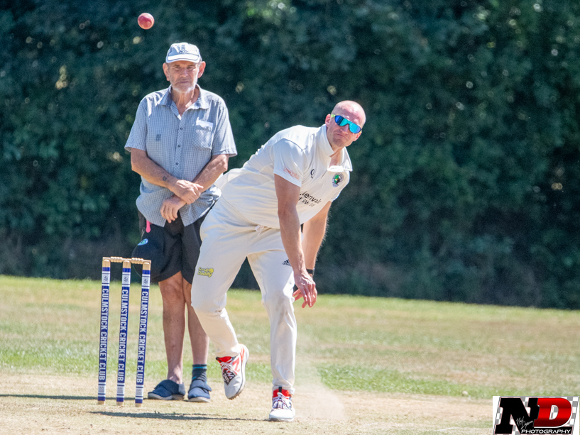 Alex Brooks bowling for Bradninch & Kentisbeare against Culmstock