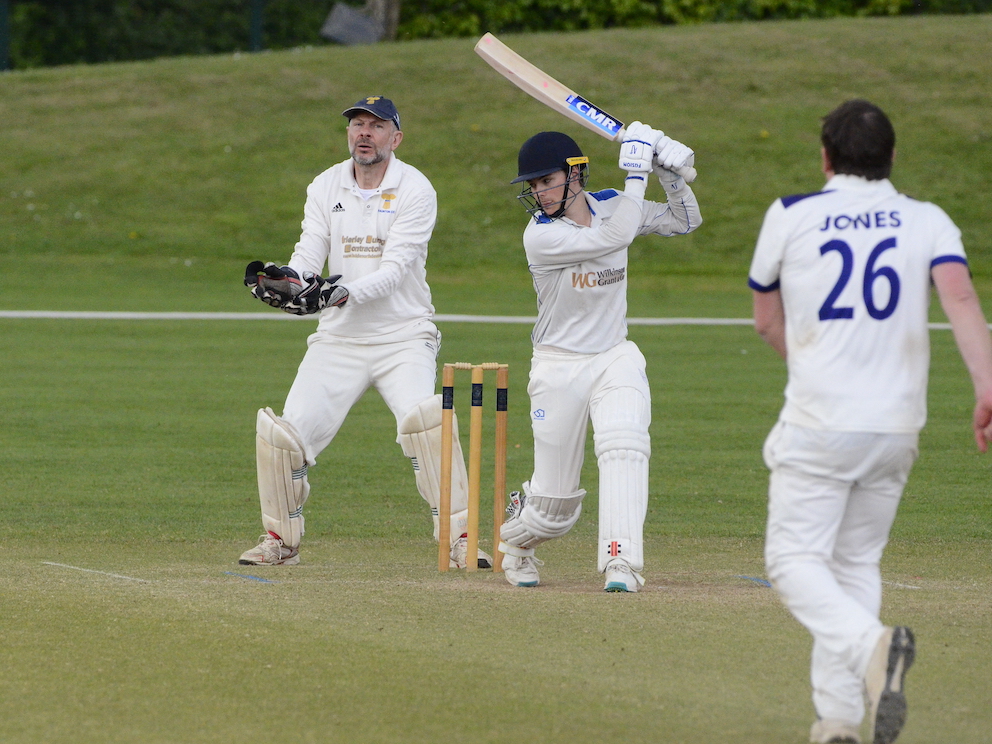 Braunton keeper Andy Wood winces as Topsham's Theo Johnson plays and misses by a whisker