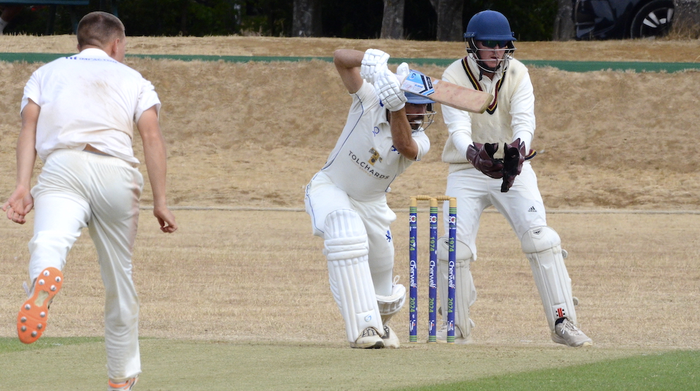 Devon's Matt Thompson drives Oxfordshire's Jack Warner through the covers