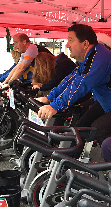 Tour organiser Warren Carr cranking up the pace at the static cycle challenge