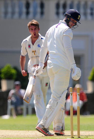 Josh Bess celebrates after bowling Cheshire's Callum Rowe
