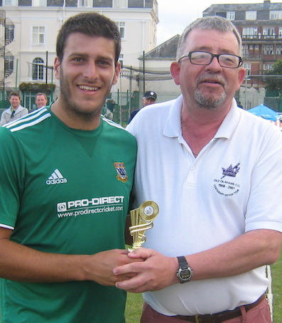 Joe Thompson (left) collecting the MoM award from adjudicator Conrad Sutcliffe
