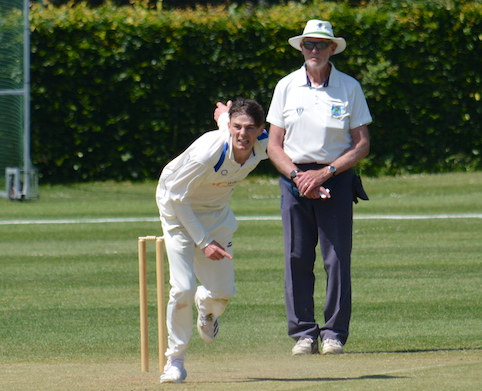 David Gambie umpiring the game between Topsham St James and Exeter 2nd XI in 2023. The bowler is Topsham's Jamie Matthews