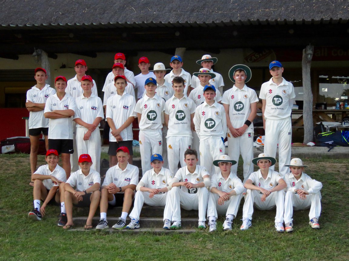 2018s playing squad in a post game team photo with Johan Rudolphs Academy Team