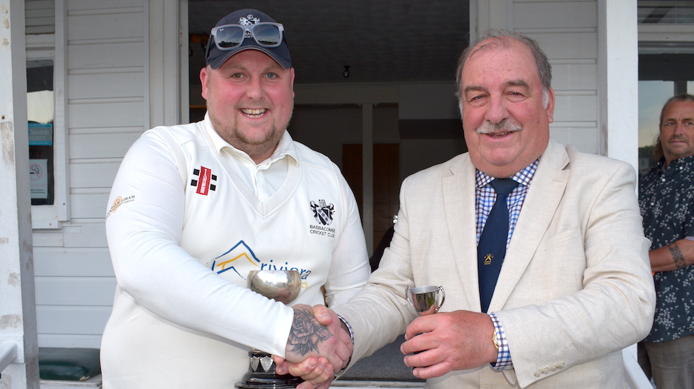 Babbacombe captain Rob Redding (left) cradles the Brockman Cup after the 2024 final. The presenter is cup chairman Tim Chapman<br>credit: Conrad Sutcliffe - no re-use without copyright owner's consent