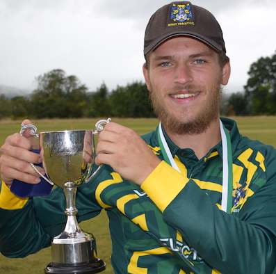 Man of the match Sam Russell with the Ted Dickinson Cup