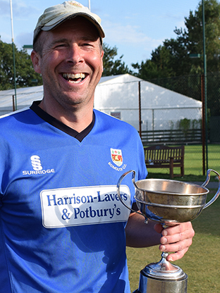 The winning captain with the silverware